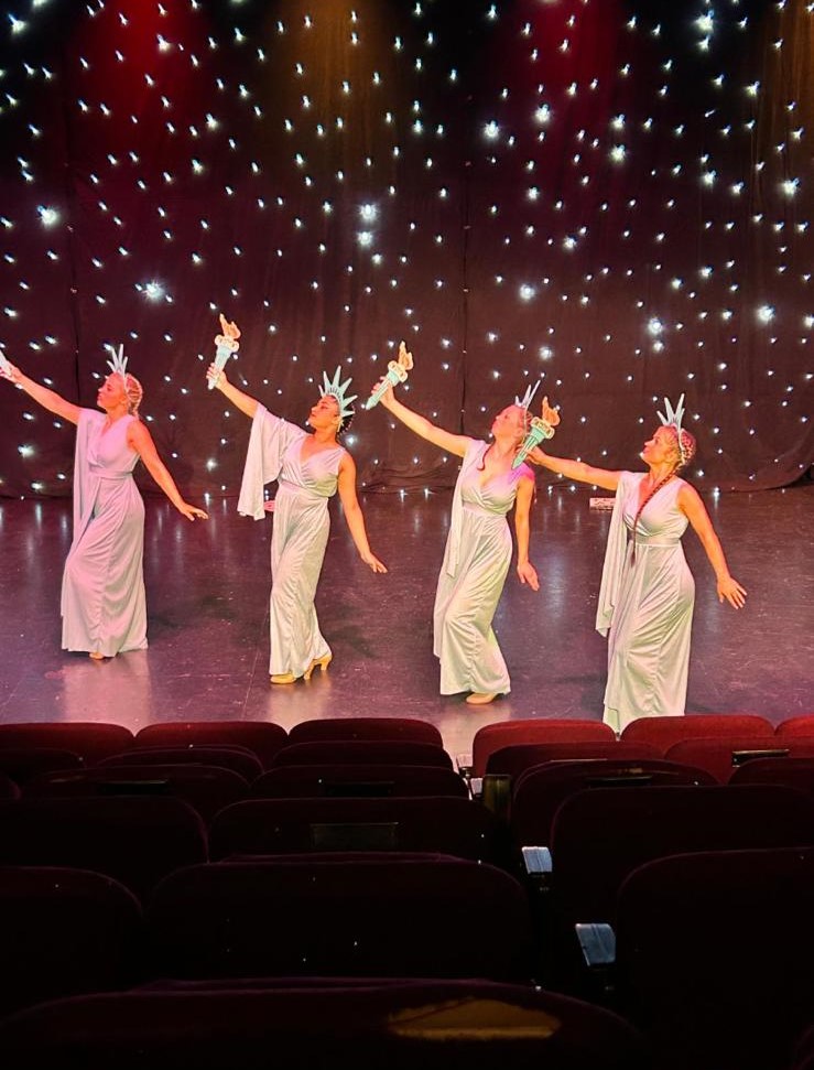 Colourful group dance number during Clairemarie’s production